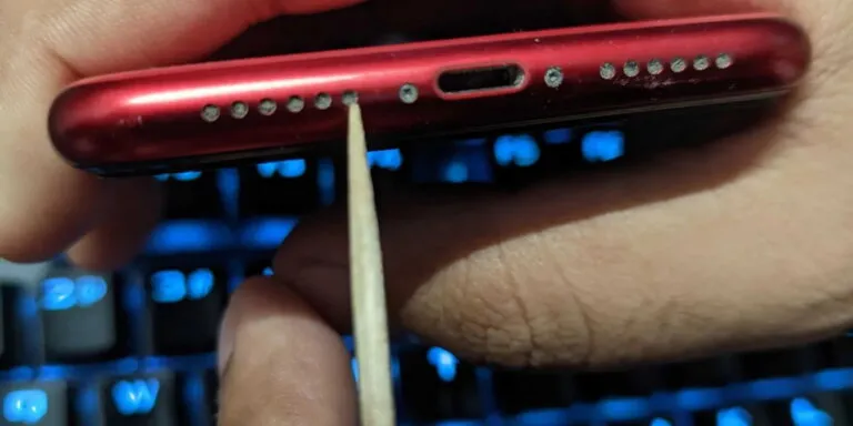 cleaning dirty iphone speaker with toothpick