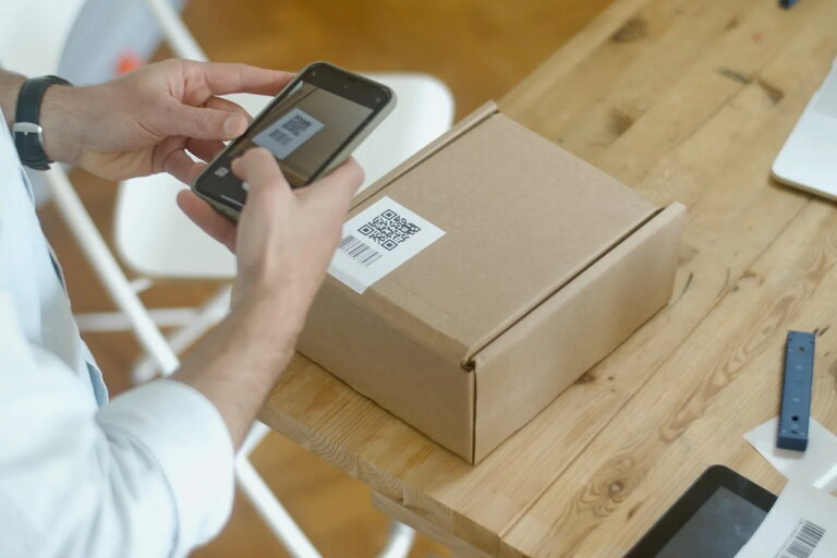 phone scanning qr code on carton box