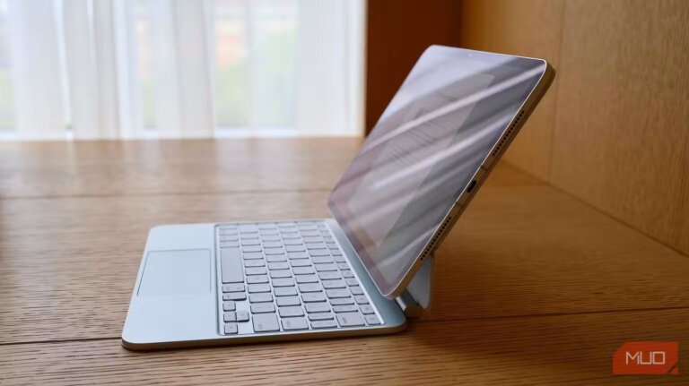 13 inch ipad pro attached to a white magic keyboard on a desk